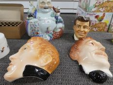 A modern Chinese Buddha, 2 face masks of American actors and a John F Kennedy character jug