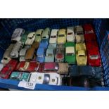 Box of vintage die cast vehicles.