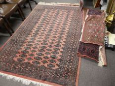 Six modern Bokhara rugs of various sizes, the largest 235 x 158cms