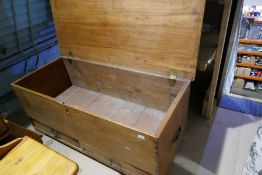 An antique oak mule chest having two drawers