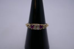 18ct diamond and ruby set gypsy ring with 4 central diamonds flanked with rubies and diamond c