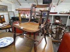 An early 19th Century, Kitchen armchair with elm seal.