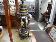 A Chinese black lacquer table lamp decorated two figures, 57cms