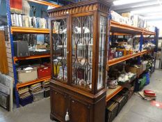A reproduction mahogany bookcase having pair of glazed doors with cupboard below