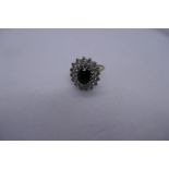 9ct yellow gold cluster ring with central sapphire surrounded white stones, marked 375, Size O, appr