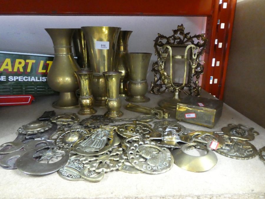 Collection of brassware including frame, vases, brass box, horse brasses