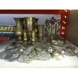 Collection of brassware including frame, vases, brass box, horse brasses