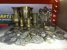 Collection of brassware including frame, vases, brass box, horse brasses