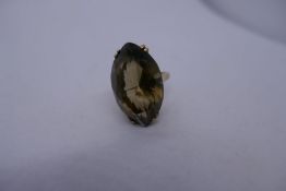 9ct yellow gold dress ring with large oval topaz, marked 375. Size L, approx 8g.