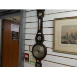 A 19th century rosewood banjo barometer by T. Davies, Llandovery