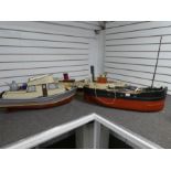 Three remote controlled wooden boats, containing some workings