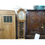 An early 20th century oak longcase clock having Westminster, Whittington and St Michael chimes, the