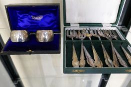 A cased pair of silver napkin rings hallmarked Sheffield 1901 Atkin Brothers. Along with a set of si