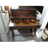 A Victorian rosewood writing table having raised back with 2 short and 1 long drawer on barley twist