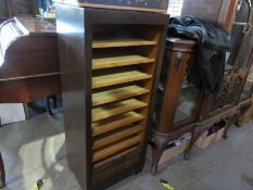 An oak tambour filing cabinet