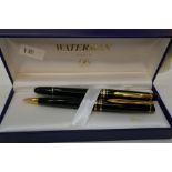 Mont Blanc; a Meisterstuck Fountain pen, a similar ballpoint pen (Waterman) and a Mont Blanc ink bot