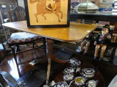 An antique mahogany breakfast card table and a Georgian mahogany armchair