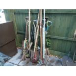 Large collection of vintage garden tools to include shears, forks, pickaxe, etc