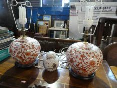A pair of modern Chinese table lamps and a small ginger jar
