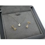 Pretty boxed 9ct White gold necklace hung with a diamond pendant approx 0.10pts diamonds and a pair