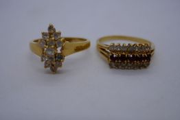 Two 18ct yellow gold dress rings, both marked 18K set with clear stones