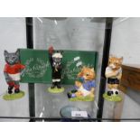 Four footballing felines by Beswick, boxed.