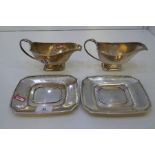 A pair of very heavy silver sauce boats and trays. Hallmarked Birmingham 1934. Alexander Clark and C