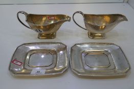 A pair of very heavy silver sauce boats and trays. Hallmarked Birmingham 1934. Alexander Clark and C