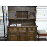 A reproduction oak draw leaf Dining table and set of six red leather Dining chairs and Kitchen dress