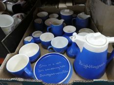 Box of blue and white advertising pottery, various milk jugs, cups, etc