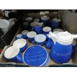 Box of blue and white advertising pottery, various milk jugs, cups, etc