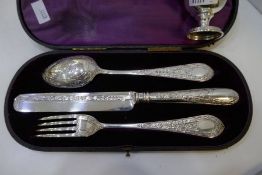 An ornate, high quality silver Victorian cased set of a decorative fork, spoon and knife. Beautifull