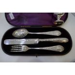 An ornate, high quality silver Victorian cased set of a decorative fork, spoon and knife. Beautifull