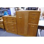 A vintage G-Plan chest having five long drawers, a similar compactum and a corner cupboard with desk