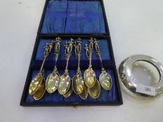 A quantity of eleven silver 800 teaspoons with a male figure on the end of the handle, and a bird en