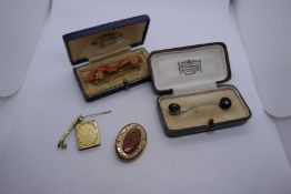 Leather cased yellow metal bar brooch with carved coral flower heads, another cased set pin, 14k gol