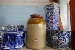 Blue and white floral decorated stick stand, stoneware jars, other blue and white vases, etc