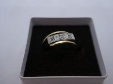 18ct yellow gold diamond cross over design ring with 3 diamonds set in square panels, marked 18ct an