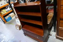 A Stag Minstrel waterfall bookcase having one long drawer
