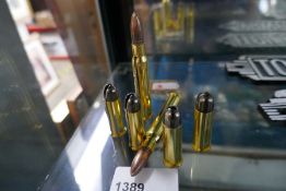 Six brass bullet penknives