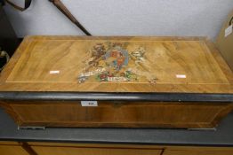 A Victorian inlaid music box having 10 Airs, the lid decorated crest