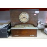 A British Time Recorder Co Ltd clock, with brass and wood case, and key