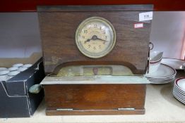 A British Time Recorder Co Ltd clock, with brass and wood case, and key