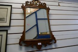 A Georgian mahogany wall mirror, having ho-ho bird surmount