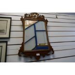 A Georgian mahogany wall mirror, having ho-ho bird surmount