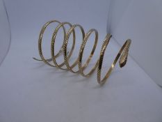 Contemporary 9ct yellow gold snake bangle with diamonds set in the eyes, each approx 0.05Carat, appr
