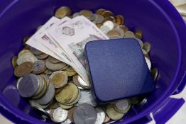 A tub of mixed coinage and continental bank notes