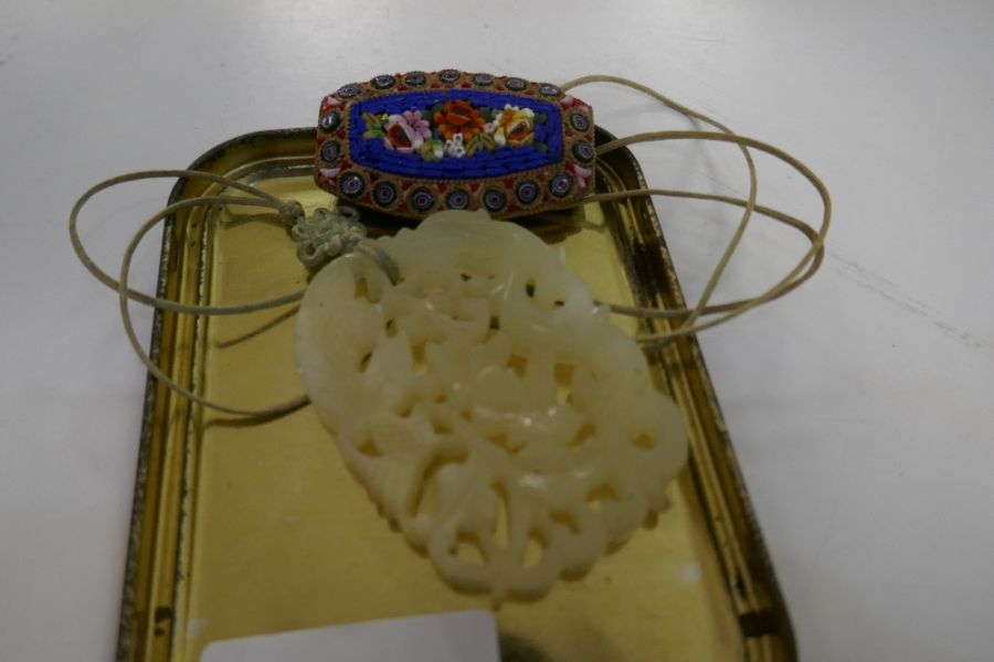 A Jade oblong pendant with pierced decoration and a micro mosaic brooch