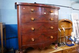 A Victorian mahogany bow front chest having two short and three long drawers