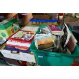 Box of antique reference books and a box of various vintage postcards